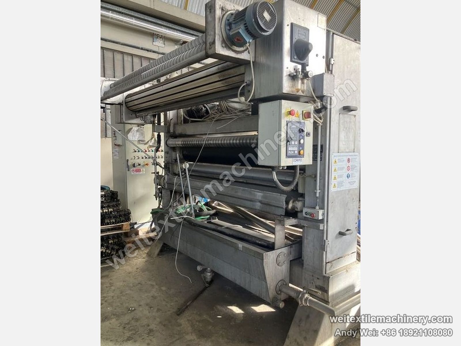 Used Beta FLC-3 squeezing machine at its previous mill, three-roller nip, top motor and Corino centering control box