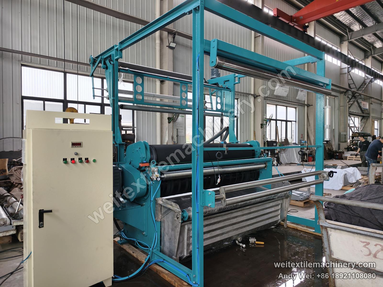Used Bianco squeezing machine (2.4 m, 2 rolls) after QL rebuild, full view with overhead feed frame, two-roll nip, stainless trough and new control cabinet