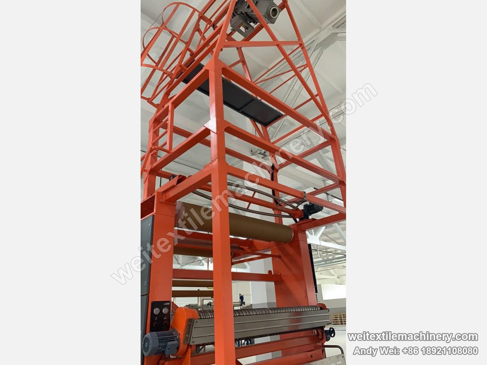 Used Bianco untwisting and opening machine, detail of the detwisting tower and opening rollers, orange steel frame, platform and gauges