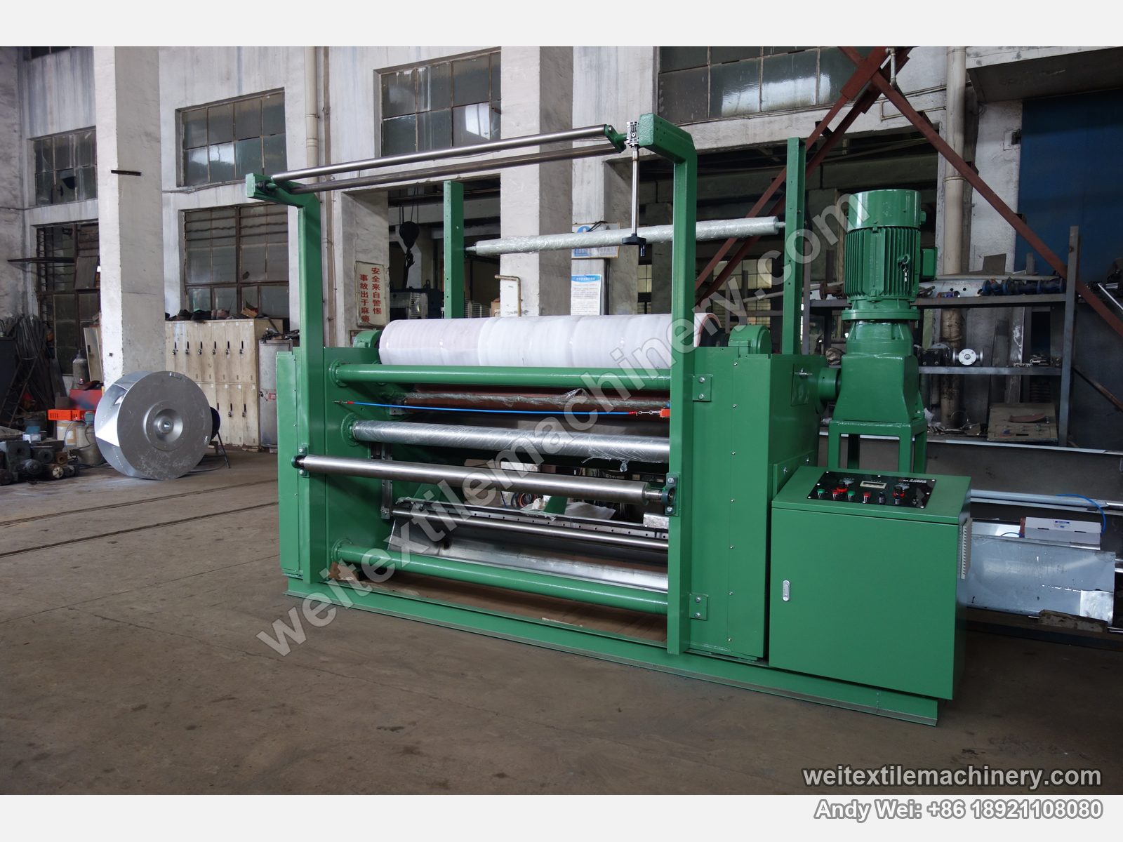 Used Brückner squeezing machine (2.2 m, 2 rolls), second unit (green frame), front view with film-wrapped rubber roll, top geared motor and control panel