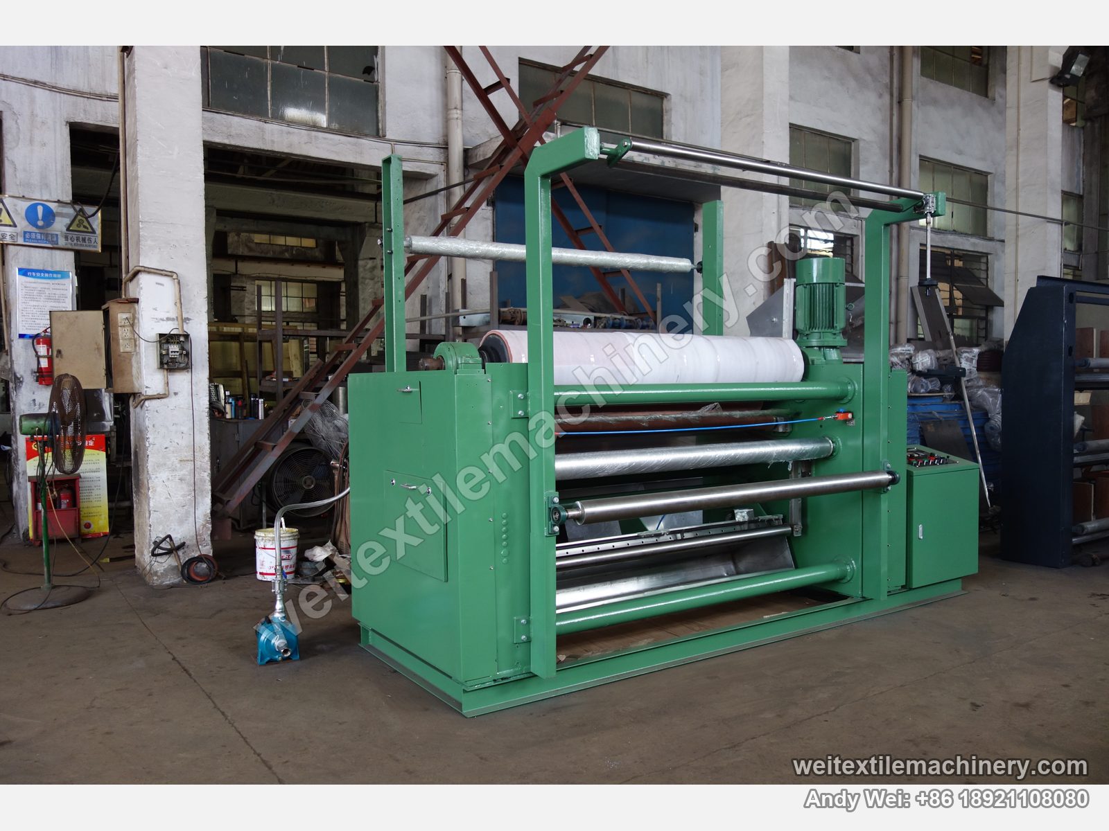 Used Brückner squeezing machine (2.2 m, 2 rolls), second unit (green frame), side view with control box, top motor and pneumatic loading