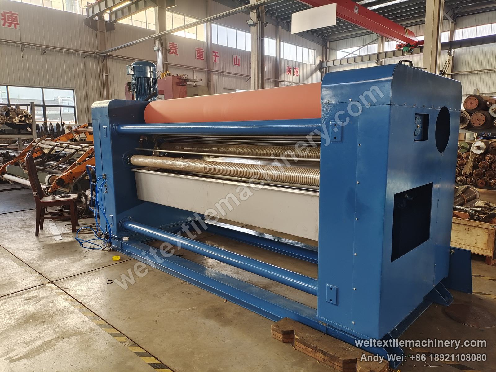Used Brückner squeezing machine (2.4 m, 2 rolls) after QL rebuild, full view with blue frame, rubber-roll nip, threaded expander rolls and stainless trough