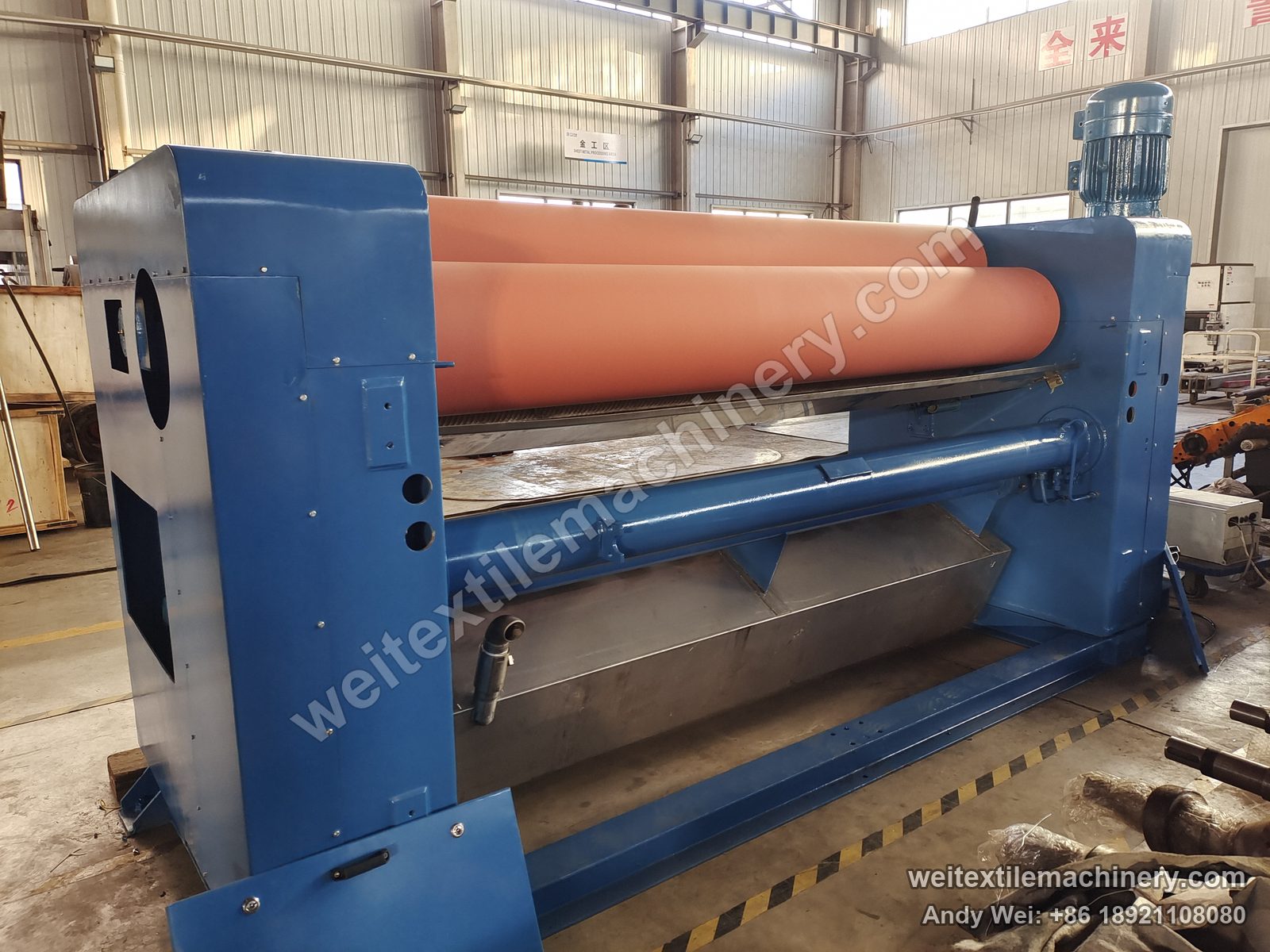 Used Brückner squeezing machine (2.4 m, 2 rolls), front view with two-roll rubber nip, top motor and stainless trough