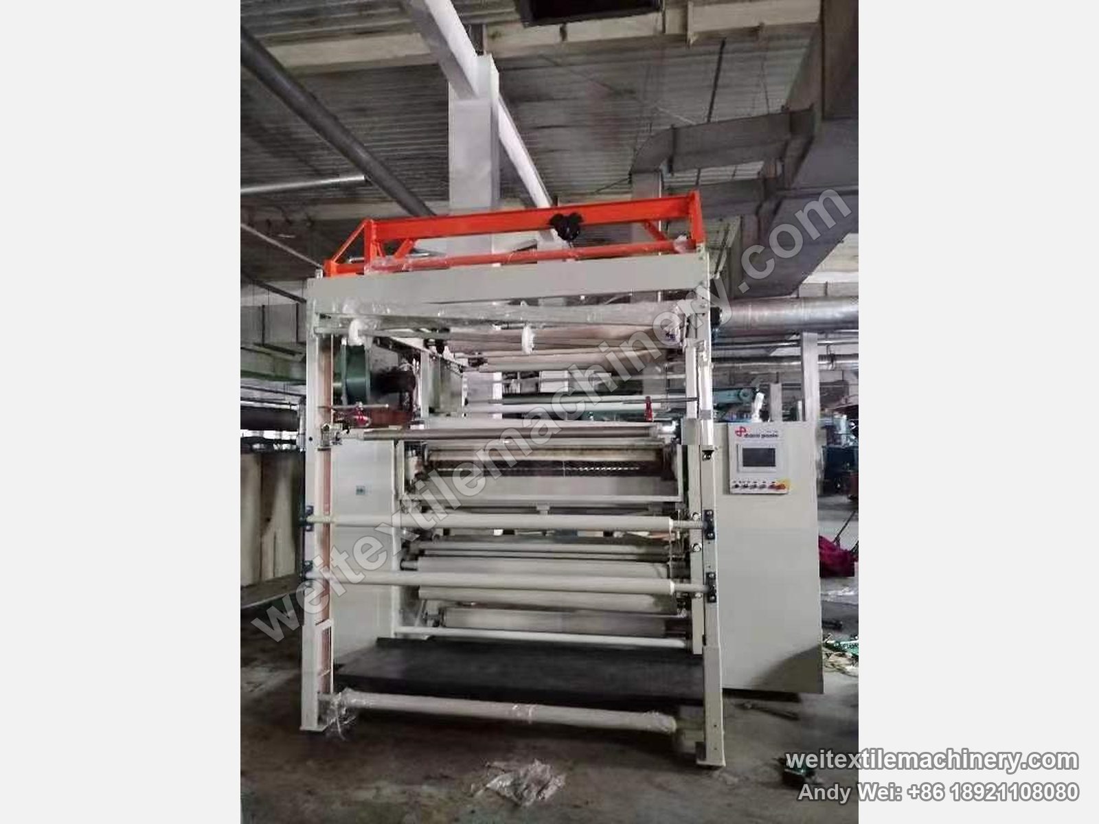 Used Danti Paolo DP7 shearing machine, front view with feed roller stack, shearing zone and orange top frame