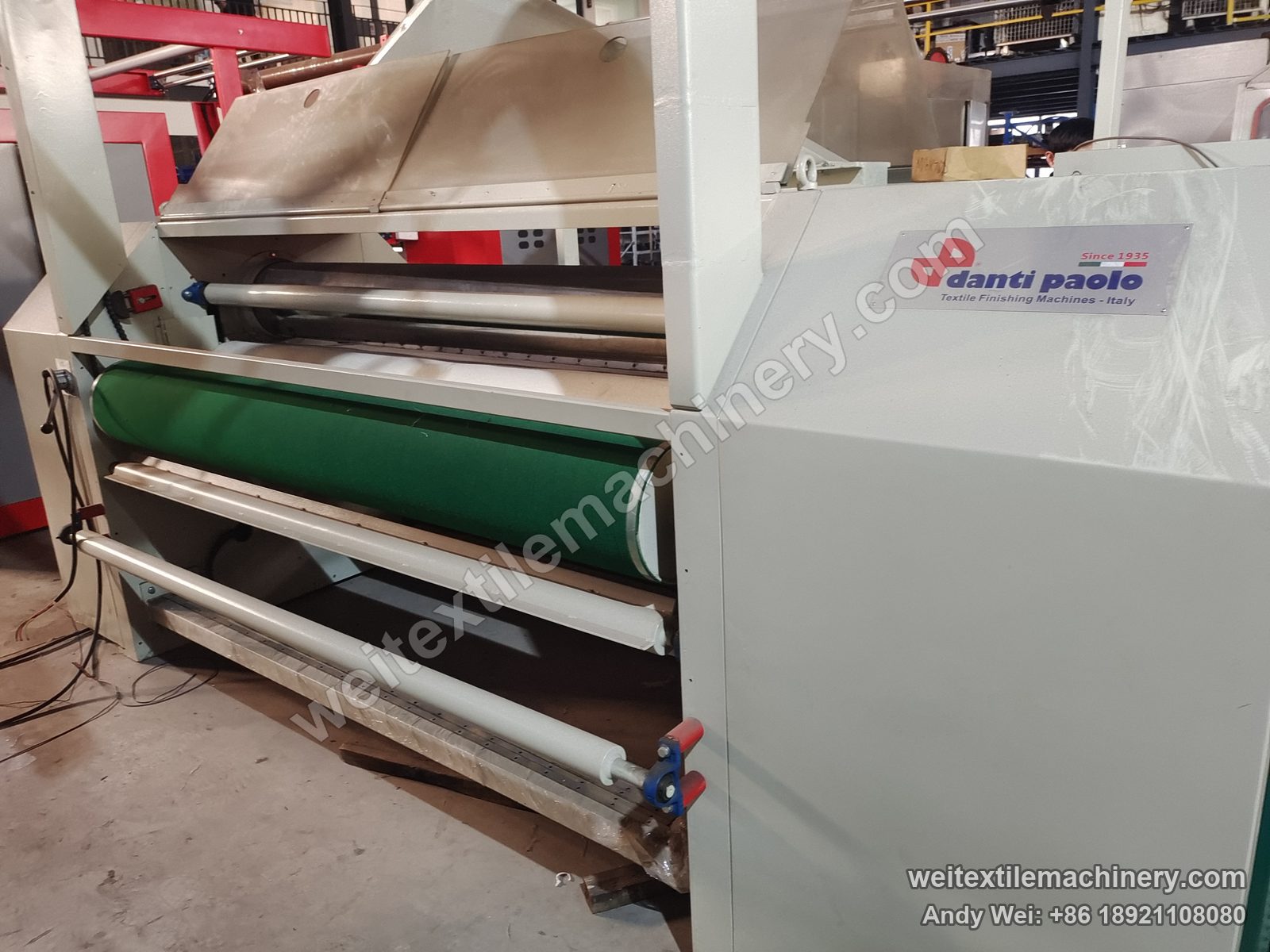 Used Danti Paolo SH8 fabric polishing machine (2.4 m), side close-up with danti paolo plate, green conveyor belt and film-wrapped rolls
