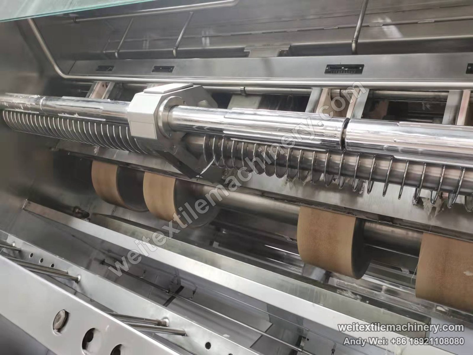 Used Famit F4 SOFT rope scouring and milling machine, hood raised: row of milling rolls, spiral spreader bar and stainless lining
