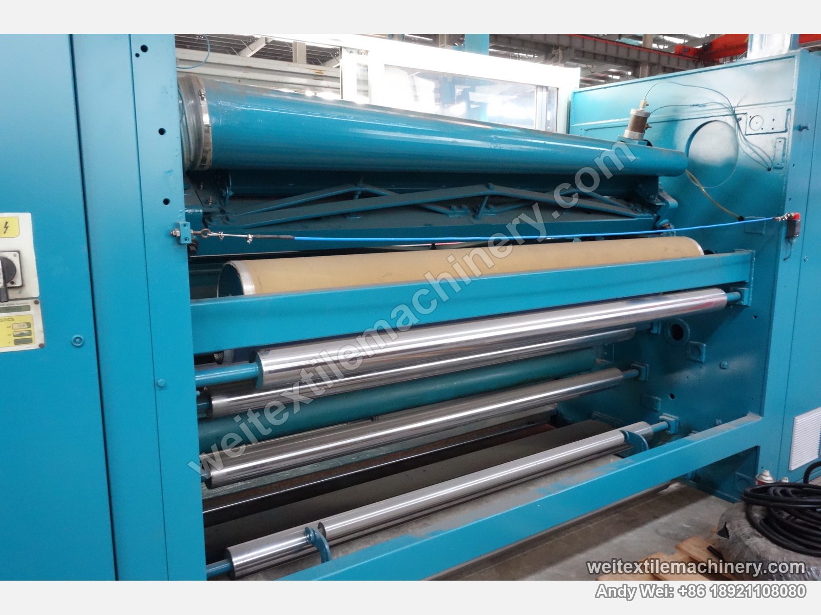 Used Lafer CMS2 shearing machine, rear roll stack detail with film-wrapped guide rolls and pneumatic cylinder