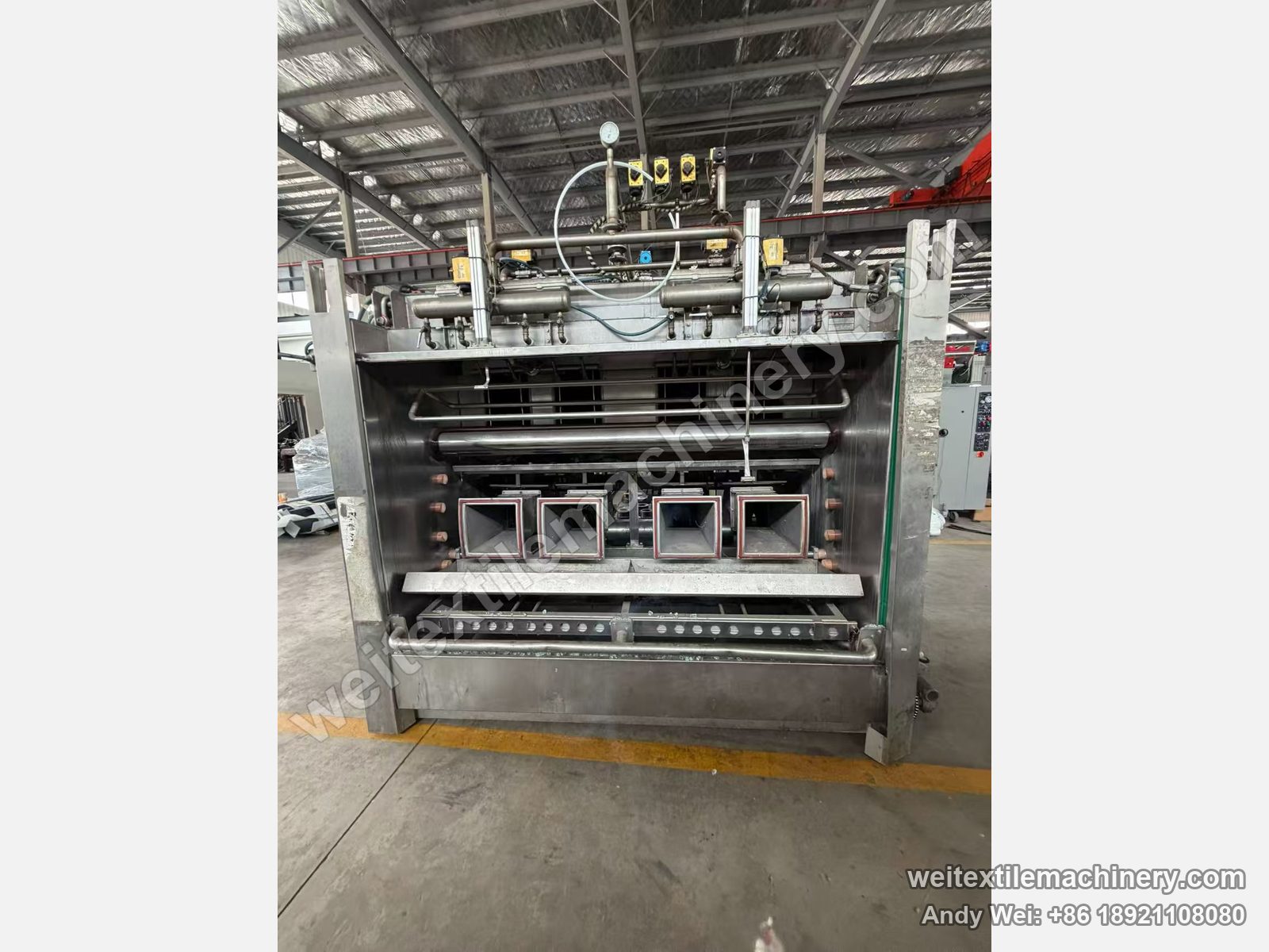 Used MAT Turbomat 4C rope scouring and milling machine, front view with stainless body, four square channel outlets and top pneumatic valves