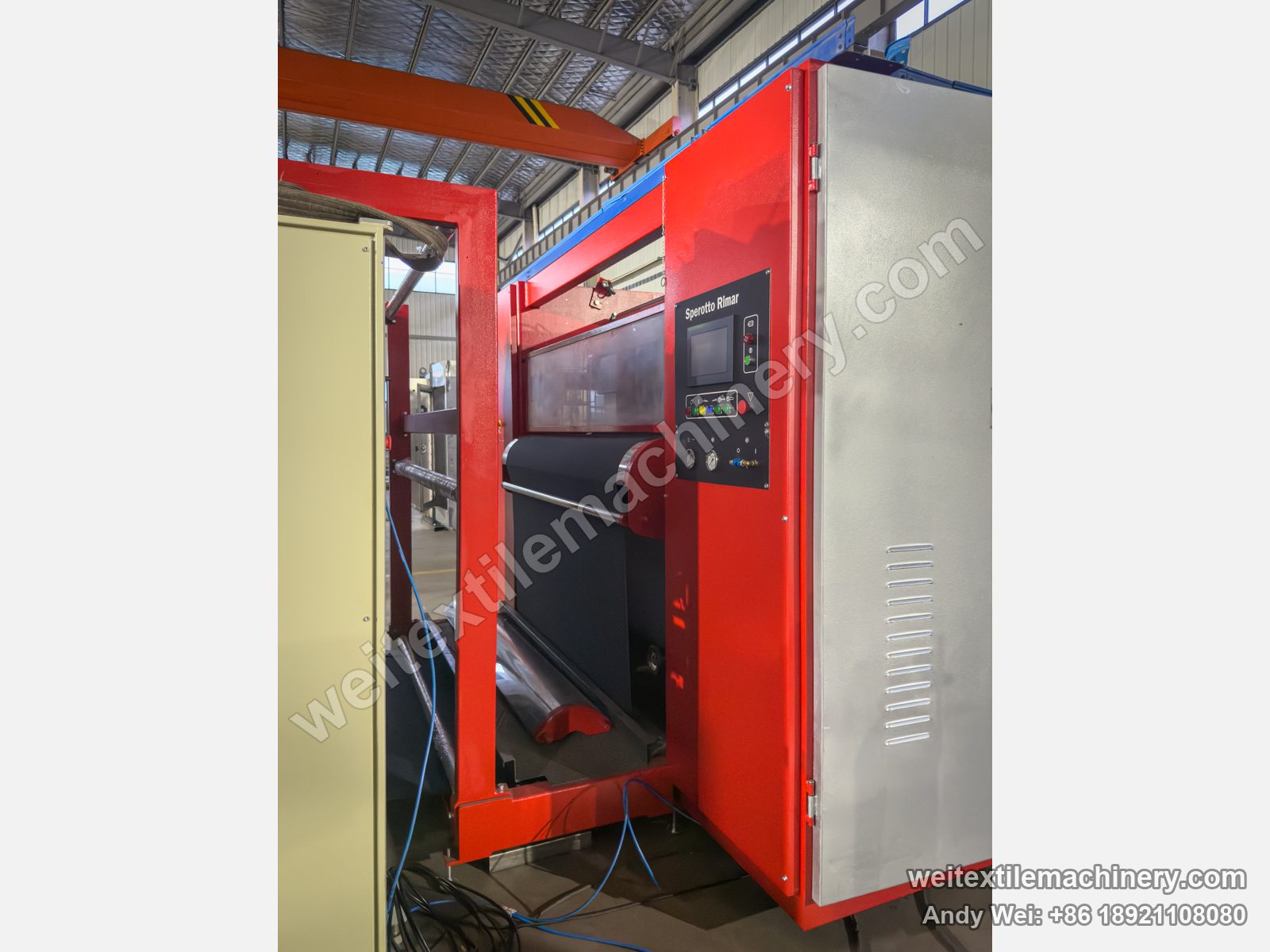 Used Sperotto Rimar Multidecat 2.0 continuous decatizing machine, three-quarter view with silver doors in red frames, overhead fabric frame and trolley