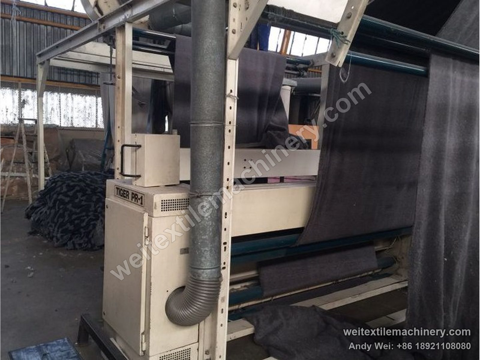 Used Sucker Müller Policut PPC-2 combined polishing and shearing machine, TIGER PR-1 unit with grey fabric over the rolls, suction duct and cream housing