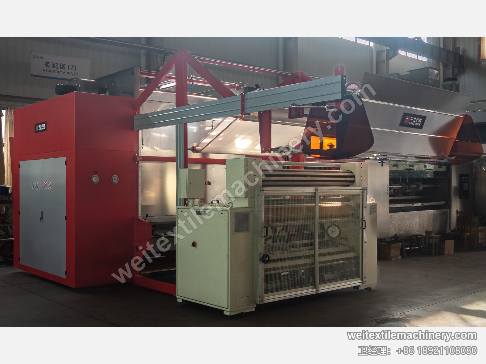 二手 Bianco Tramatex SP04 针轮式整纬机在千立装配区接入整线，bianco 标牌、网格护门与针轮组，两侧为千立机型