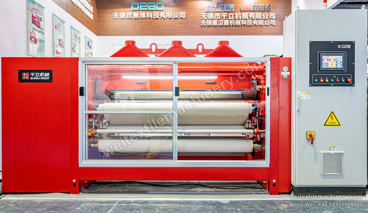 QL WPF-TG Fabric Polishing Machine, front view at an exhibition stand, felt blanket and rollers behind sliding doors