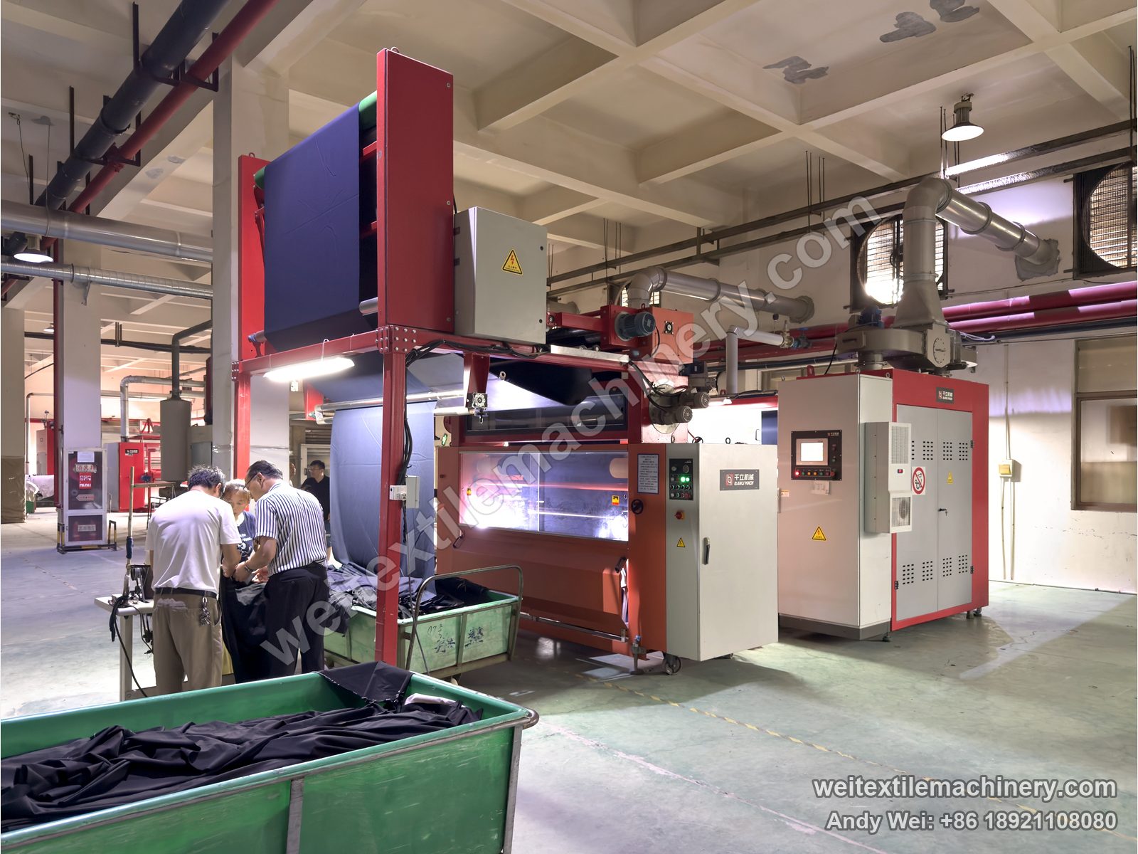 QL WPF-LXZN-P Continuous Pressure Decatizing Machine, in operation at a customer mill, dark fabric over the top frame