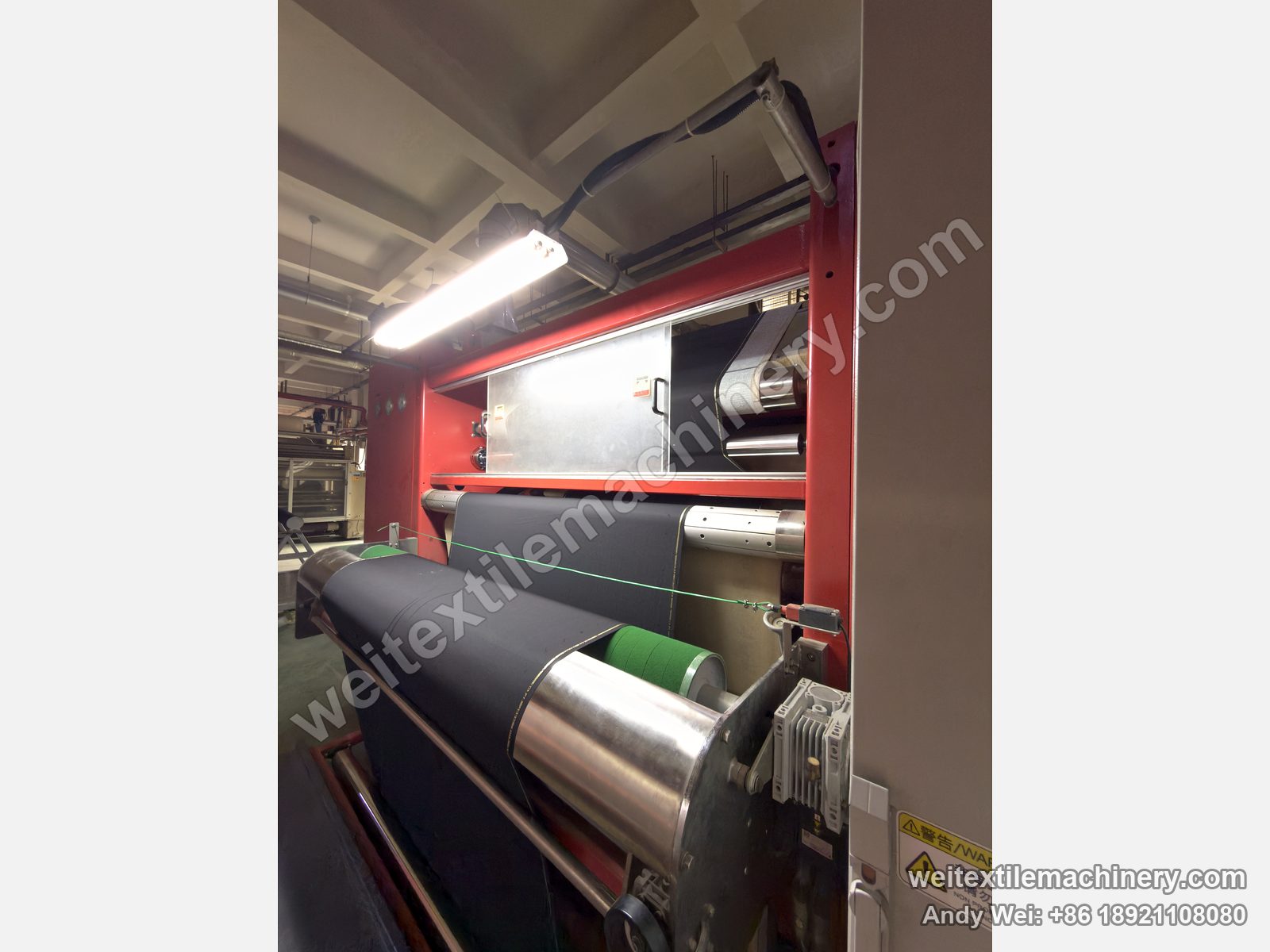 QL WPF-LXZN-P Continuous Pressure Decatizing Machine, detail at a customer mill, dark fabric over the rollers