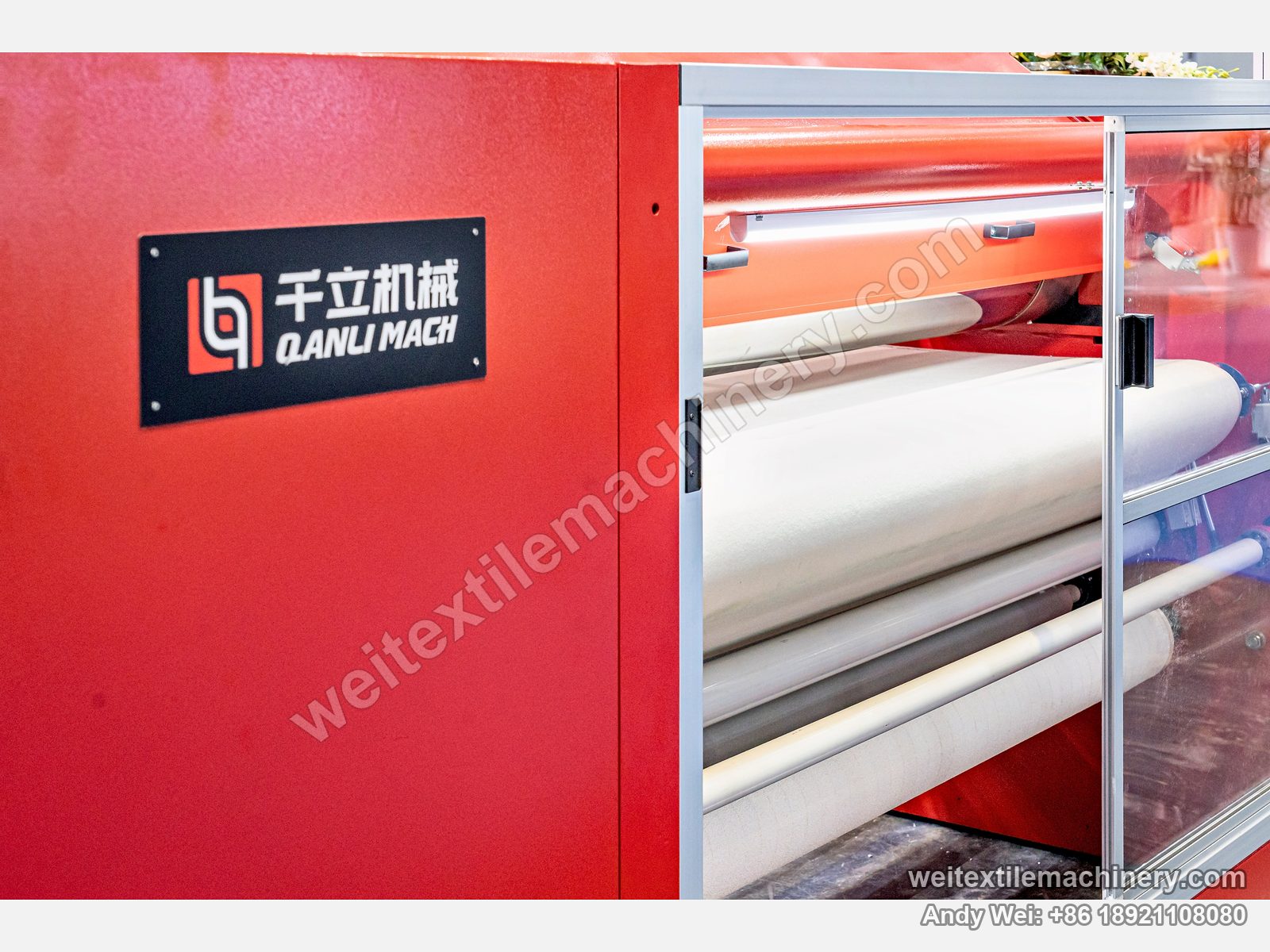 QL WPF-TG Fabric Polishing Machine, detail at an exhibition stand, QL brand plate and felt blanket behind the sliding door