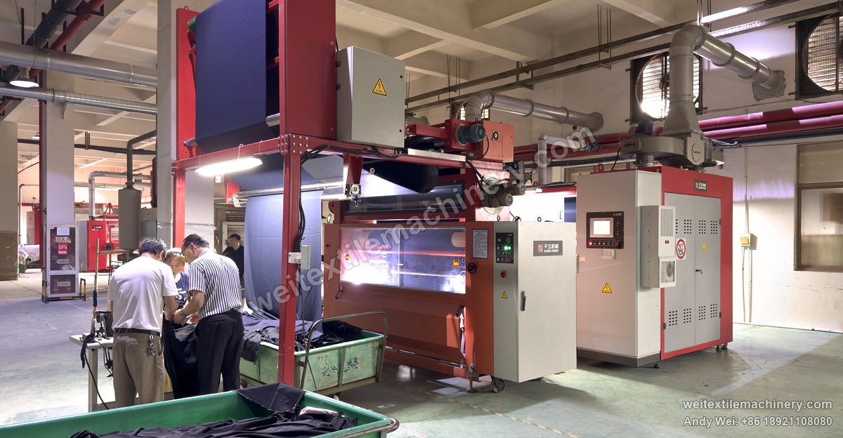 WPF-LXZN-P continuous pressure decatizing machine on a fabric trial at a customer mill, a Qianli Machinery nameplate on the machine, operators checking the cloth beside it